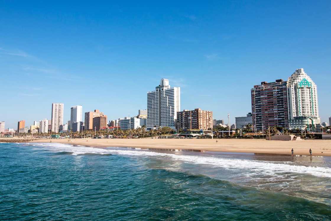 The ocean and beach against Golden Mile coastal city skyline and blue sky in Durban The ocean and beach against Golden Mile coastal city skyline and blue sky in Durban