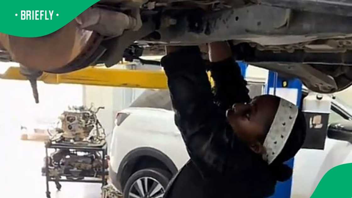 Woman works as mechanic in video Woman works as mechanic in video