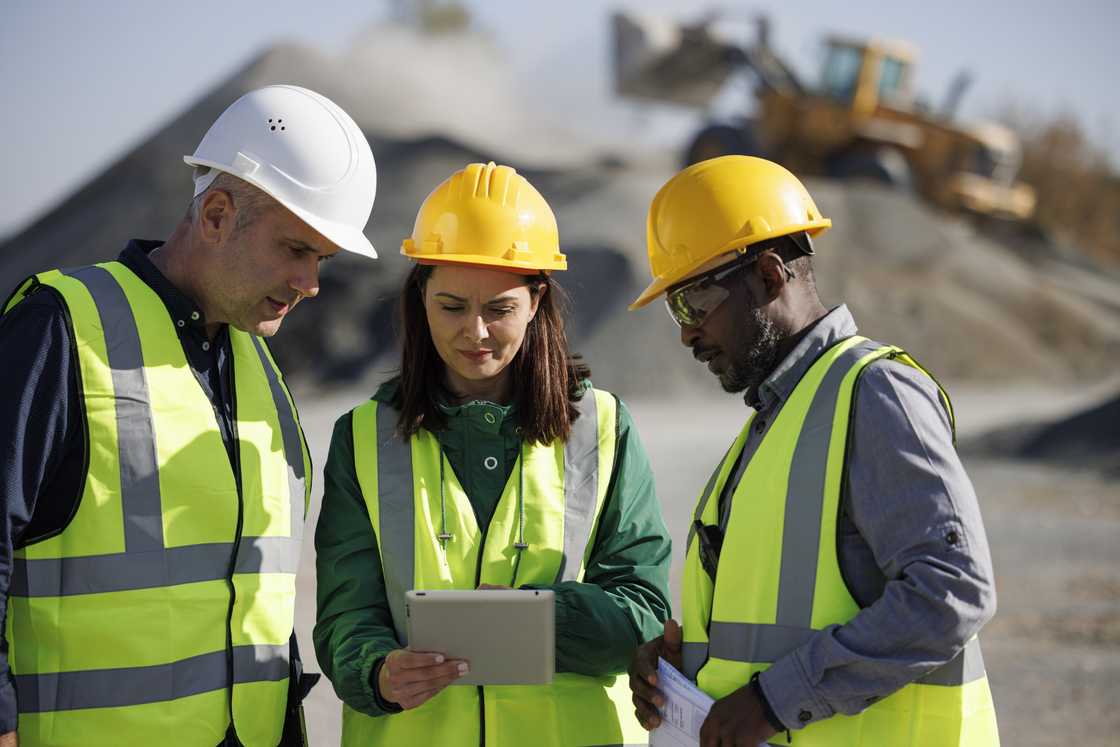 Engineers discussing at a building site.