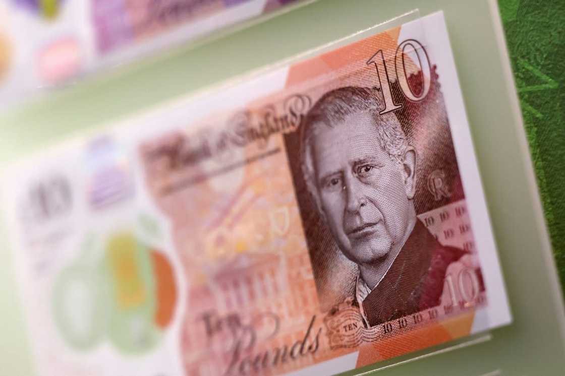 Bank notes and coins that feature an image of Britain's King Charles III are pictured on display during a photocall for 'The Future of Money' exhibition, at the Bank of England Museum in the City of London on February 27, 2024