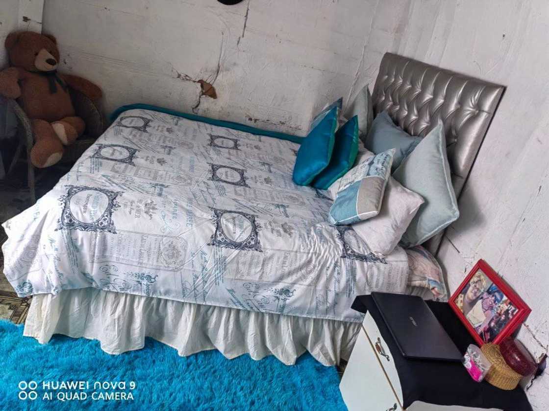 Eastern Cape woman shows her bedroom.