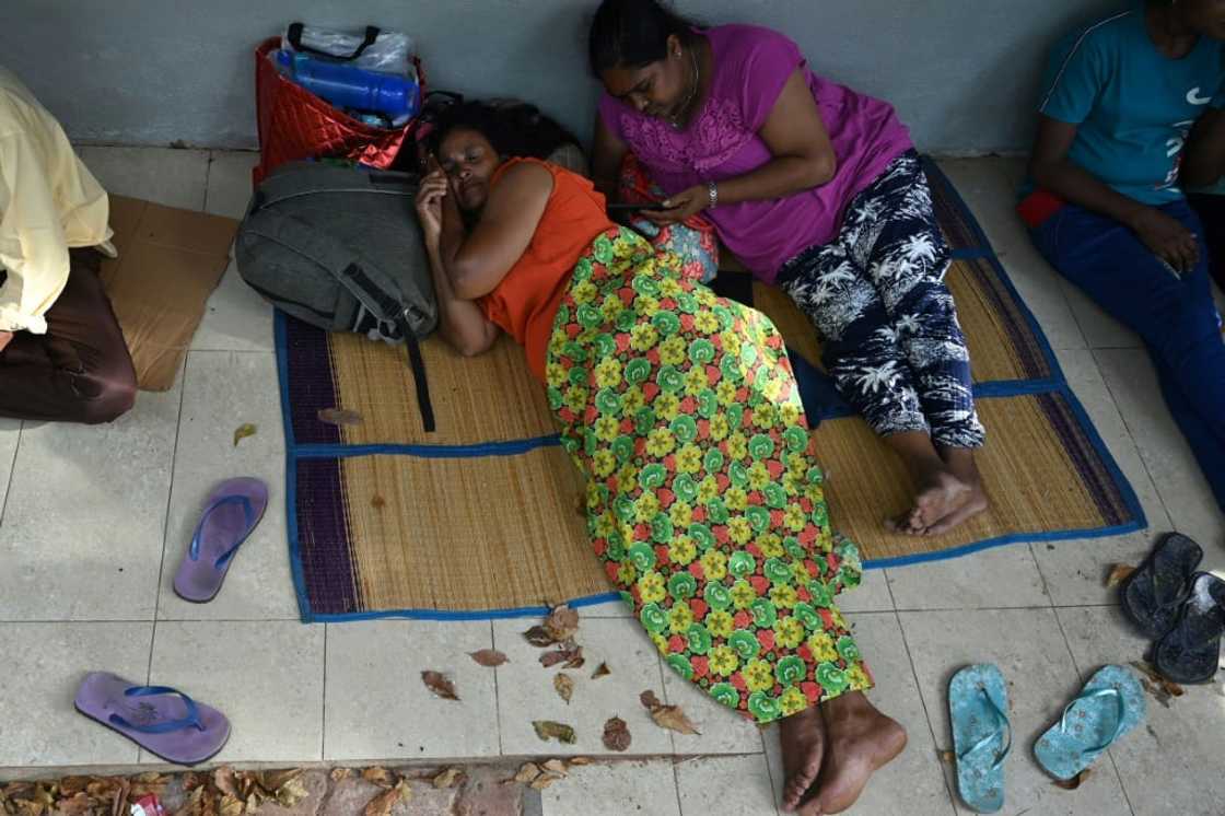 Many passport applicants travel long distances from rural areas and then spend hours without food or water for fear of losing their place in line Many passport applicants travel long distances from rural areas and then spend hours without food or water for fear of losing their place in line