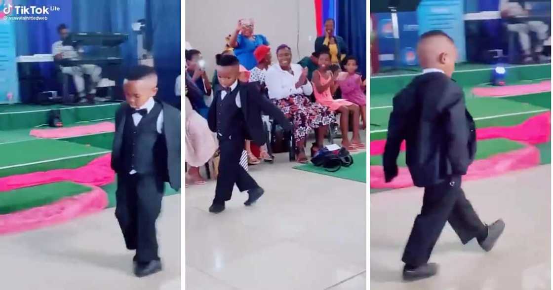 The small child walked the runway in a serious way. The small child walked the runway in a serious way.