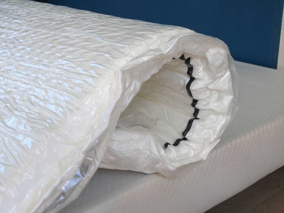 A stock image of a compressed mattress