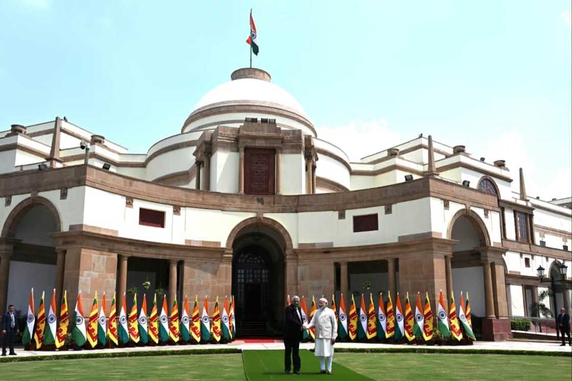 Sri Lanka's President Ranil Wickremesinghe (L) shakes hands with India's Prime Minister Narendra Modi before a meeting in New Delhi