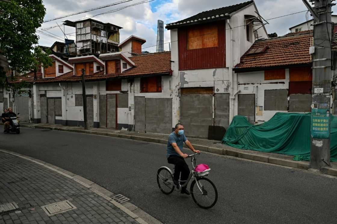 The Laoximen neighbourhood, one of Shanghai's oldest, is increasingly dominated by boarded-up doorways as the city pushes forward with renovation plans The Laoximen neighbourhood, one of Shanghai's oldest, is increasingly dominated by boarded-up doorways as the city pushes forward with renovation plans