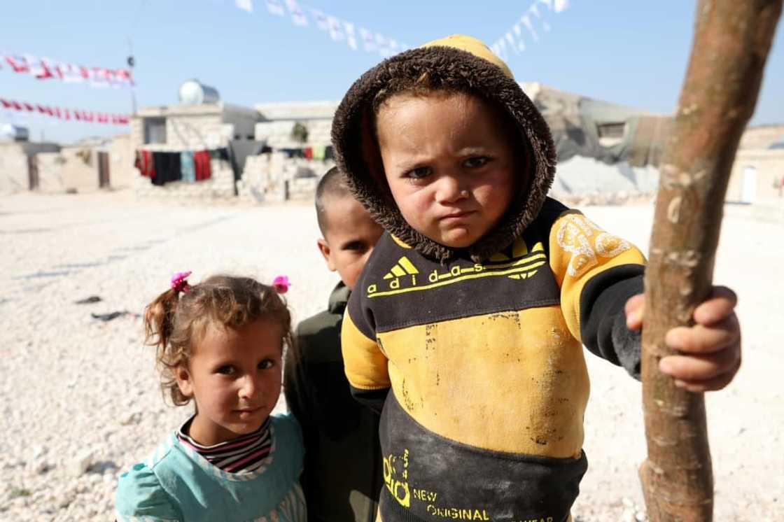 Displaced Syrians are pictured at a newly built housing complex constructed with Turkish support at Mashhad Ruhin, in the Syrian rebel-held northwestern province of Idlib Displaced Syrians are pictured at a newly built housing complex constructed with Turkish support at Mashhad Ruhin, in the Syrian rebel-held northwestern province of Idlib