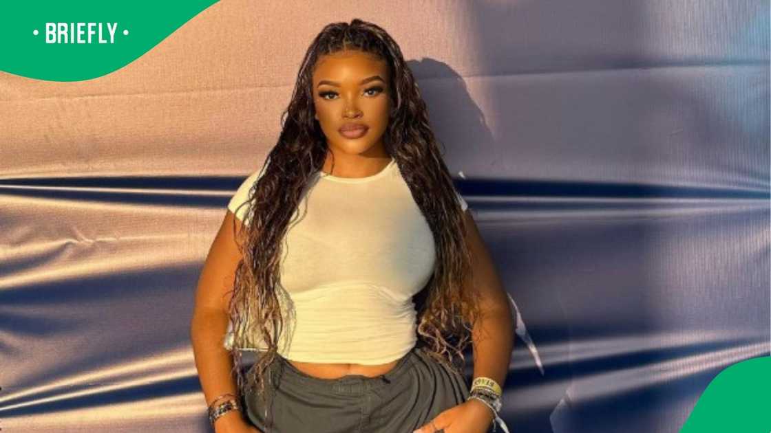 Woman shows damage done by braids