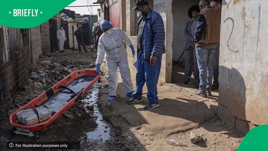 An investigation is conducted at the scene following the attack that at least 12 people were killed and nine others injured in a shooting at the informal settlement of Jumpers in the Cleveland area of Johannesburg An investigation is conducted at the scene following the attack that at least 12 people were killed and nine others injured in a shooting at the informal settlement of Jumpers in the Cleveland area of Johannesburg