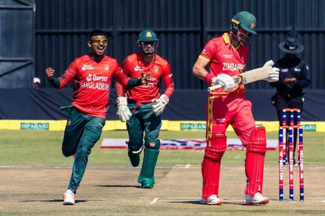Bangladesh bowler Mosaddek Hossain (L) celebrates taking the wicket of Zimbabwe captain Craig Ervine (R) during the second Twenty20 cricket international at Harare Sports Club on July 31, 2022. Bangladesh bowler Mosaddek Hossain (L) celebrates taking the wicket of Zimbabwe captain Craig Ervine (R) during the second Twenty20 cricket international at Harare Sports Club on July 31, 2022.