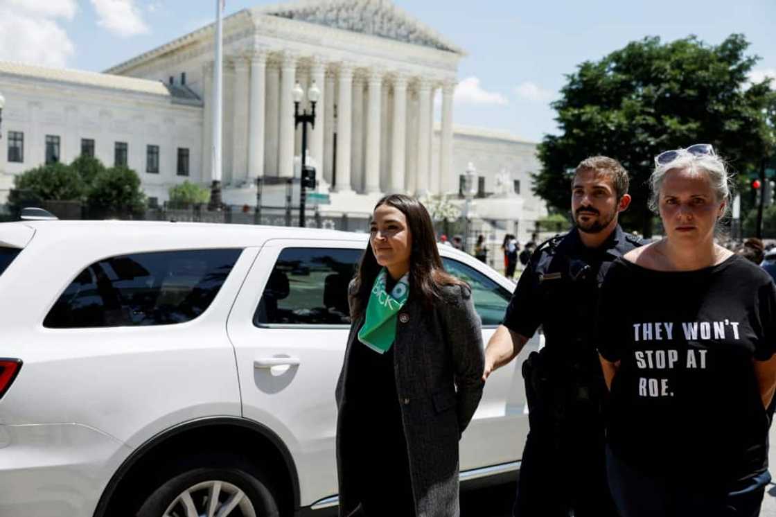 Democratic Representative Alexandria Ocasio-Cortez of New York was one of 17 lawmakers detained by US Capitol Police Officers at a protest for abortion rights in front of the US Supreme Court Building on July 19, 2022 in Washington, DC Democratic Representative Alexandria Ocasio-Cortez of New York was one of 17 lawmakers detained by US Capitol Police Officers at a protest for abortion rights in front of the US Supreme Court Building on July 19, 2022 in Washington, DC