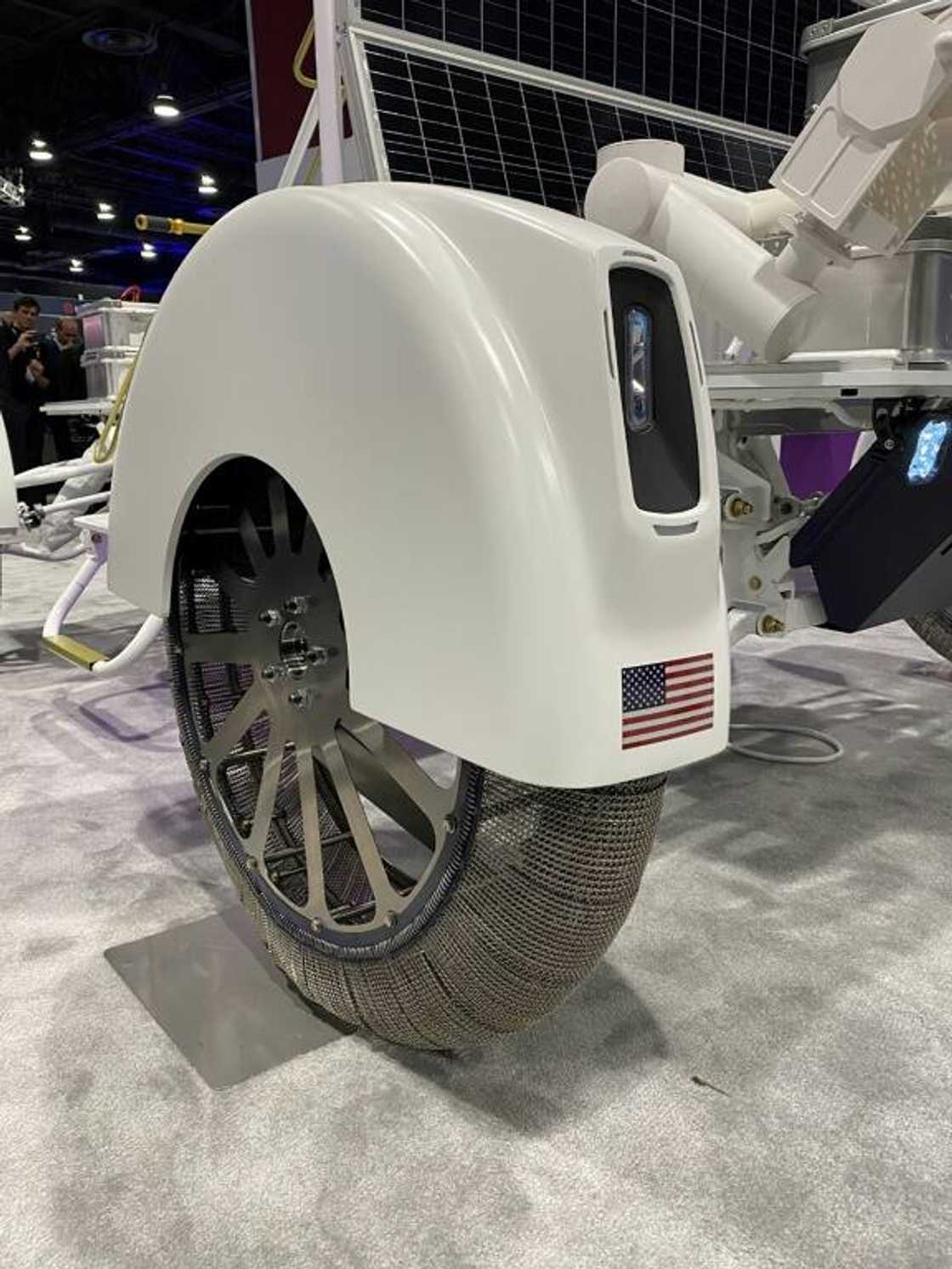 Dynetics' prototype, which will achieve a top speed of nine miles per hour (15 kph), includes a robotic arm and metal wheels that are braided like textiles, to maximize traction on the sandy surface and deal with any rocks they encounter Dynetics' prototype, which will achieve a top speed of nine miles per hour (15 kph), includes a robotic arm and metal wheels that are braided like textiles, to maximize traction on the sandy surface and deal with any rocks they encounter