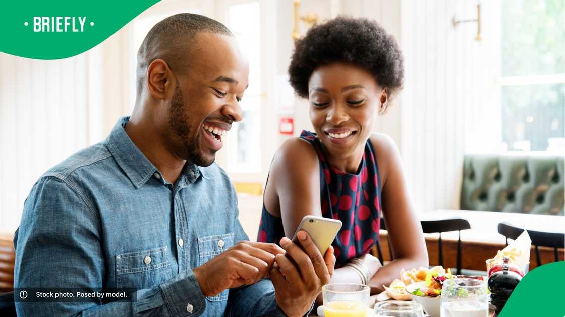 People laughing at their phone.