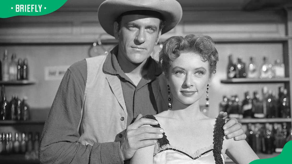 James Arness (as Marshal Matt Dillon) and Amanda Blake (as Kitty Russell) in a 1955 episode of Gunsmoke James Arness (as Marshal Matt Dillon) and Amanda Blake (as Kitty Russell) in a 1955 episode of Gunsmoke