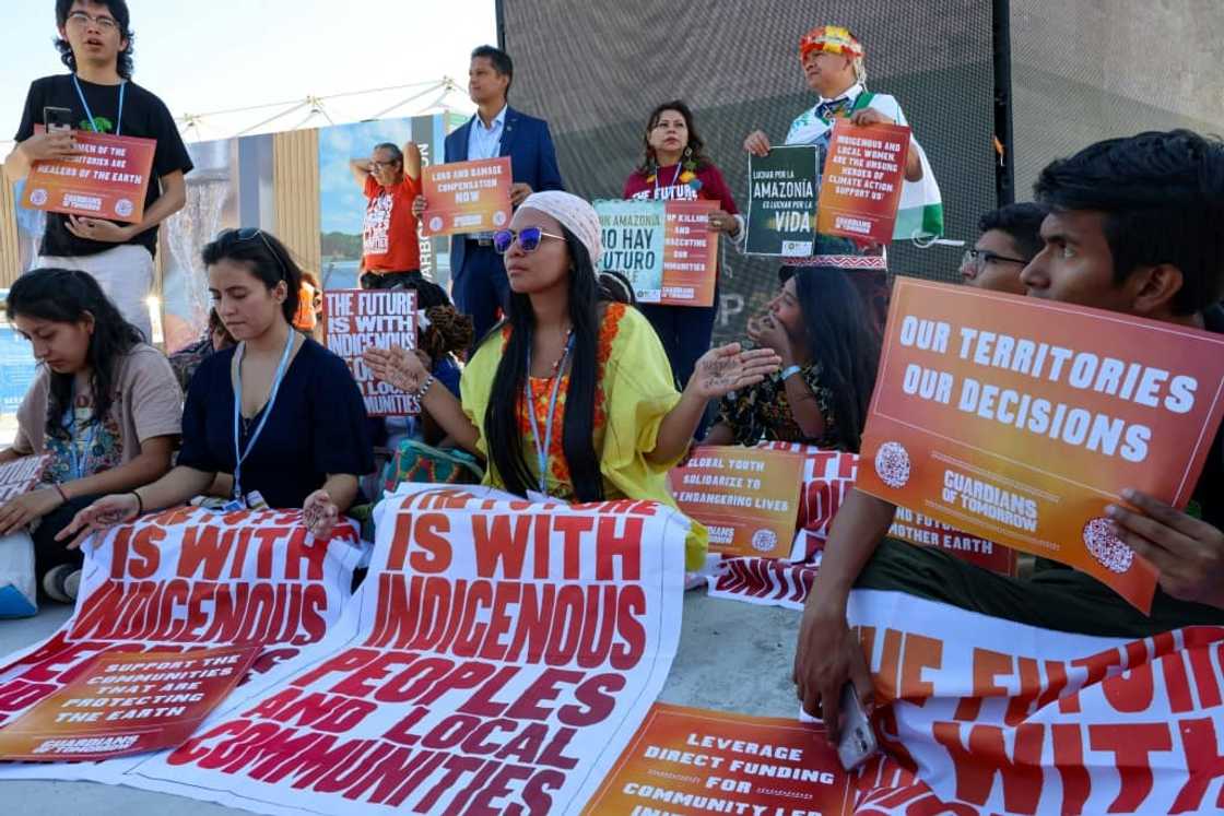 Climate activists take part in a protest inside the Sharm el-Sheikh International Convention Centre late last week