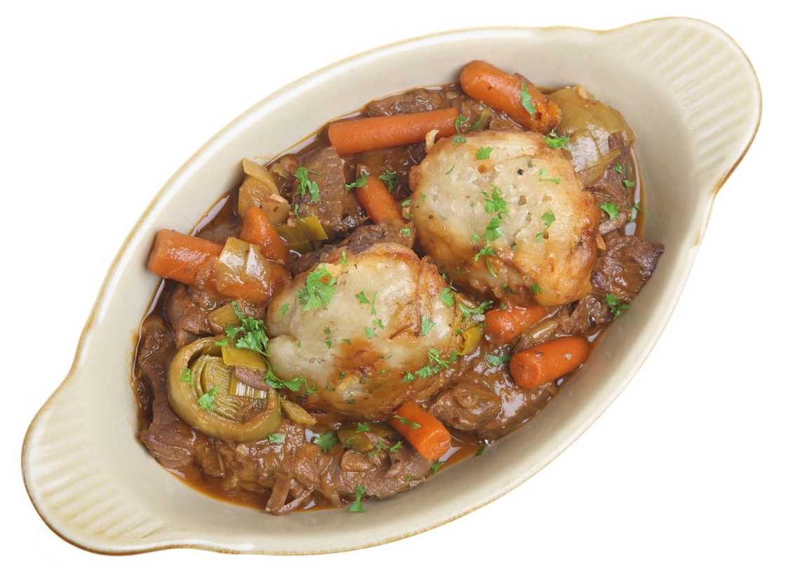 Beef stew and dumplings served Beef stew and dumplings served