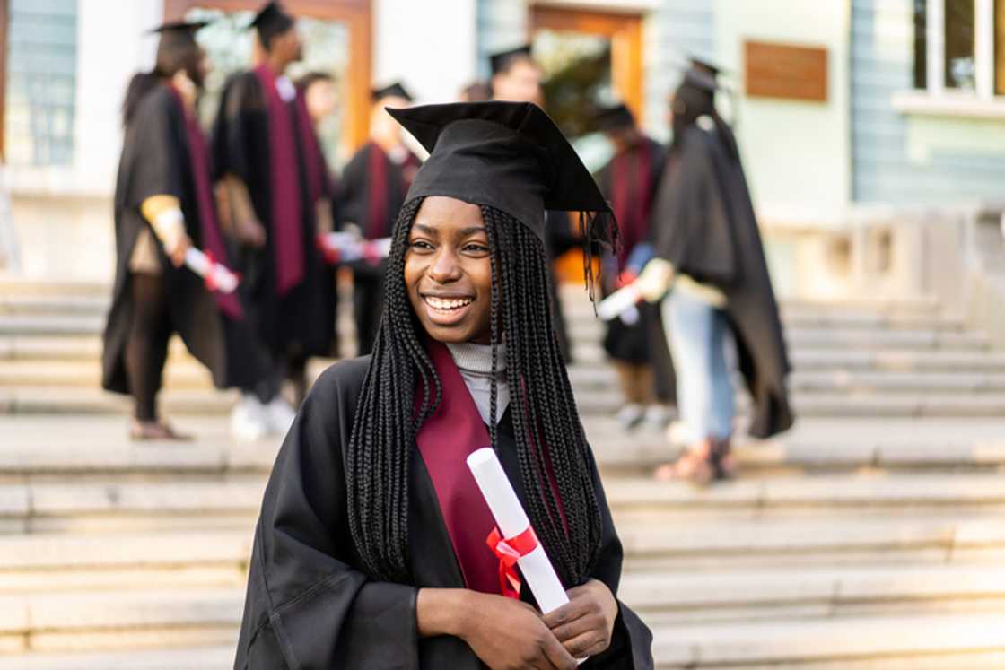 In South Africa, a woman was seen shopping while proudly wearing her two graduation belts. In South Africa, a woman was seen shopping while proudly wearing her two graduation belts.