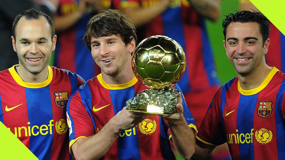 Lionel Messi hoisted the 2010 Ballon d'Or prize alongside his Barcelona teammates Andres Iniesta and Xavi Hernandez.