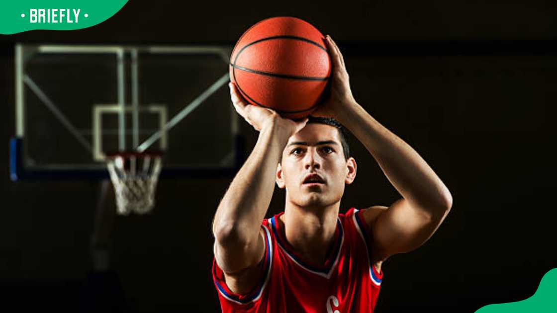 Basketball player shooting at the hoop