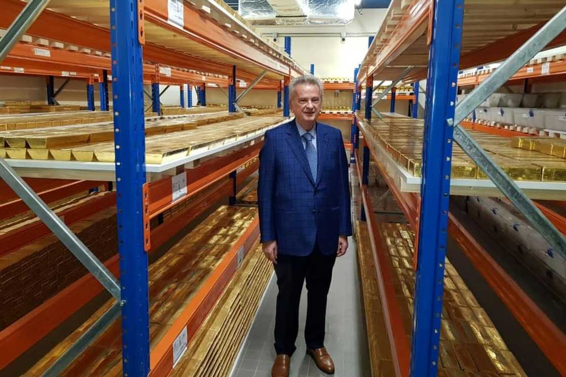Lebanon's central bank governor Riad Salameh stands next to stacks of gold bars in the bank vaults in the Lebanese capital Beirut on November 24, 2022 Lebanon's central bank governor Riad Salameh stands next to stacks of gold bars in the bank vaults in the Lebanese capital Beirut on November 24, 2022