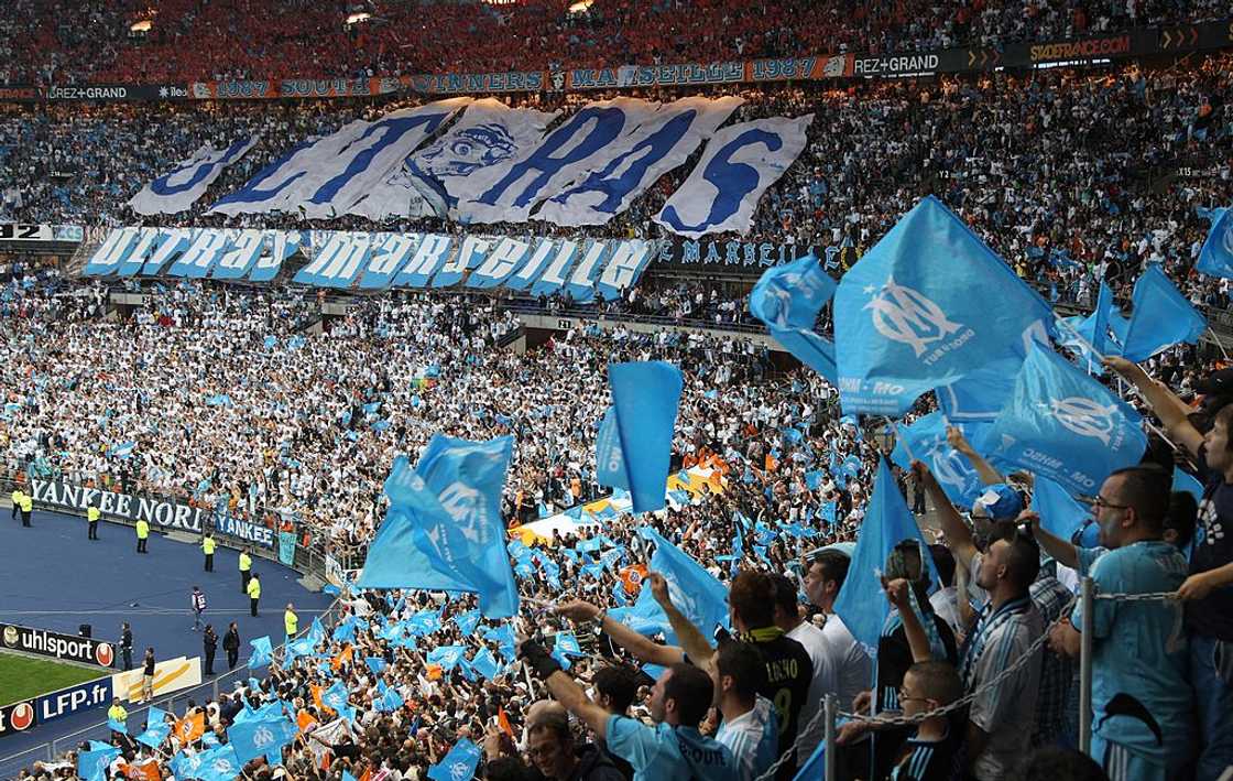 Supporters of Marseille football club wave flags Supporters of Marseille football club wave flags