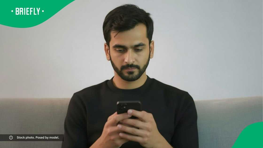 A man looking at his phone.