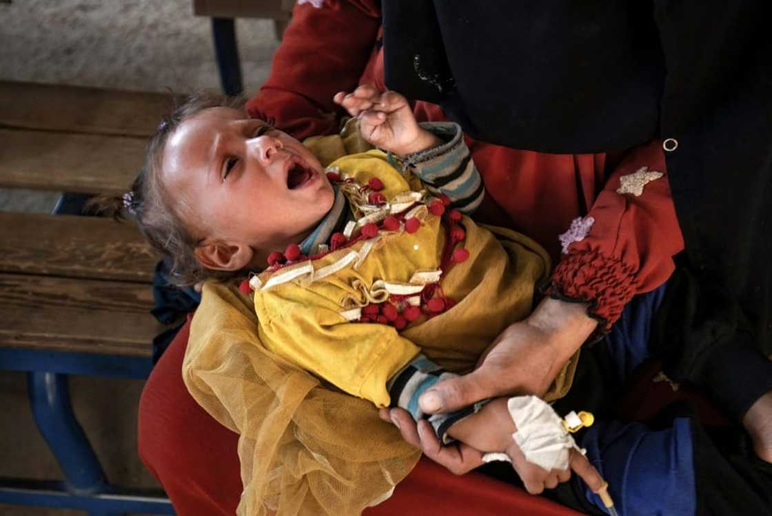 A child suffering from cholera receives treatment at the Al-Kasrah hospital in Syria's eastern province of Deir Ezzor