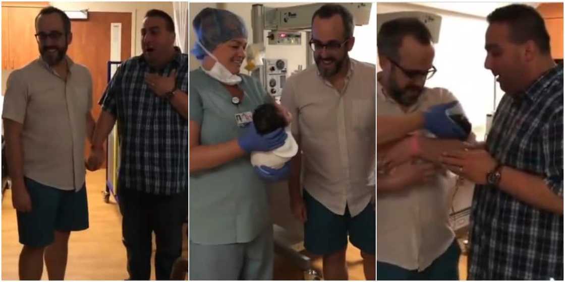 A father was excited as he carried his baby for the first time A father was excited as he carried his baby for the first time