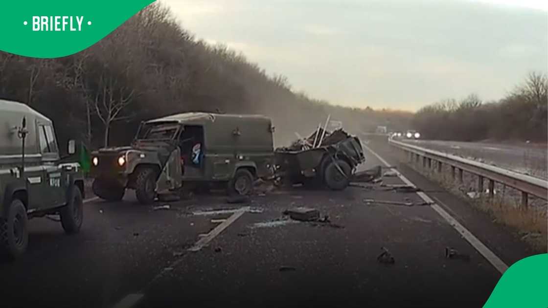 The olive-green utility vehicle skidded violently on two wheels before crashing down on its left side along the multi-lane road The olive-green utility vehicle skidded violently on two wheels before crashing down on its left side along the multi-lane road