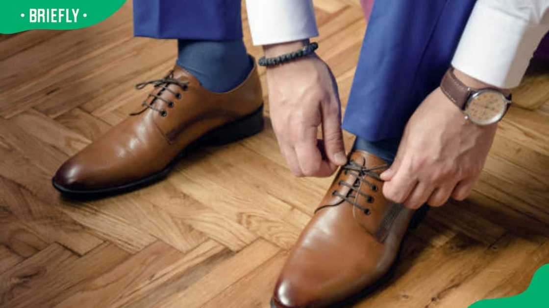 A man lacing his shoes