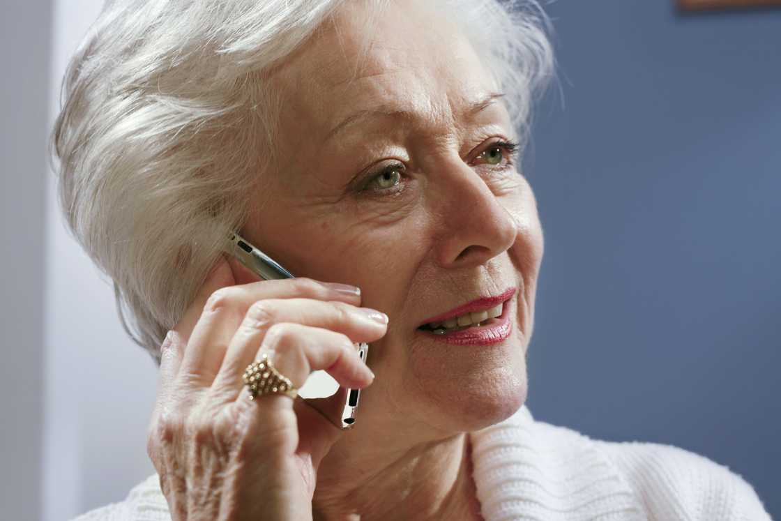 Older woman on the phone.
