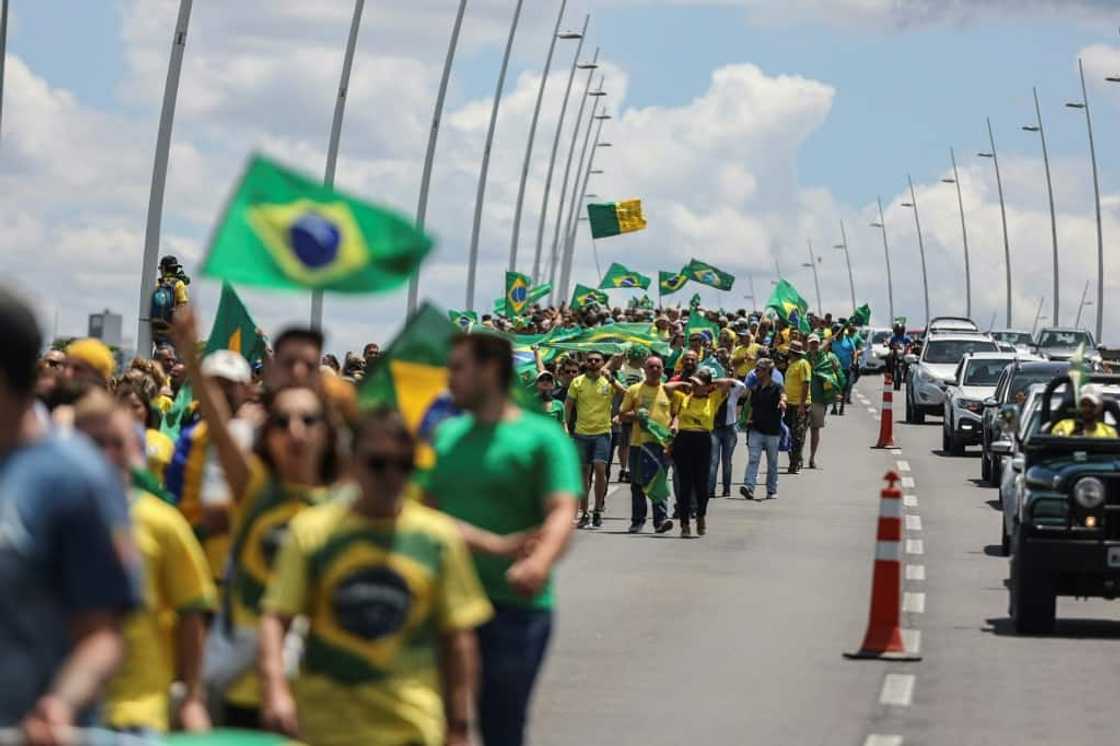 Supporters of President Jair Bolsonaro march toward army barracks in Florianopolis, Brazil, on November 2, 2022 Supporters of President Jair Bolsonaro march toward army barracks in Florianopolis, Brazil, on November 2, 2022