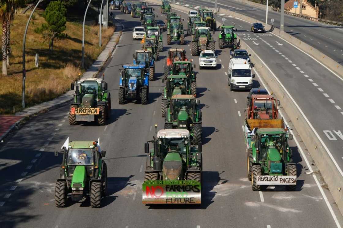 Farmers protesting on a motorway near Barcelona on Wednesday Farmers protesting on a motorway near Barcelona on Wednesday
