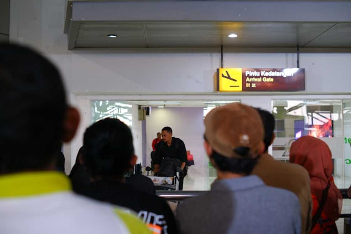 Travellers waiting in line Travellers waiting in line