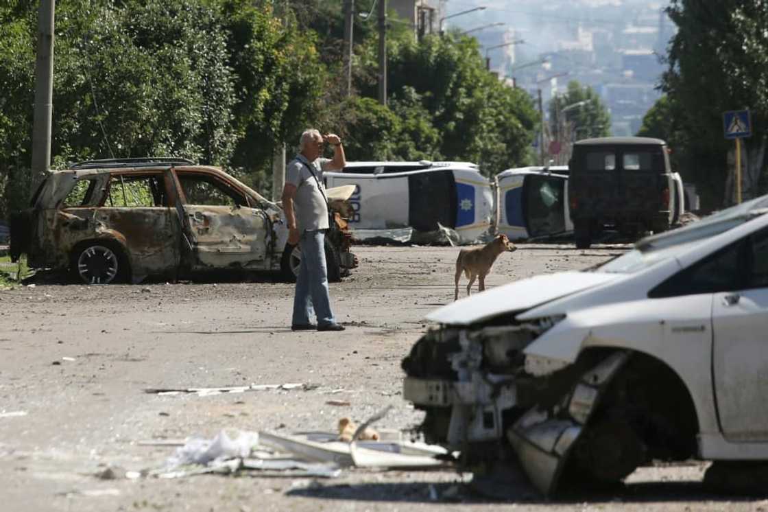 Police have dragged the wreckage of destroyed cars and vans into the streets to create a network of obstacles