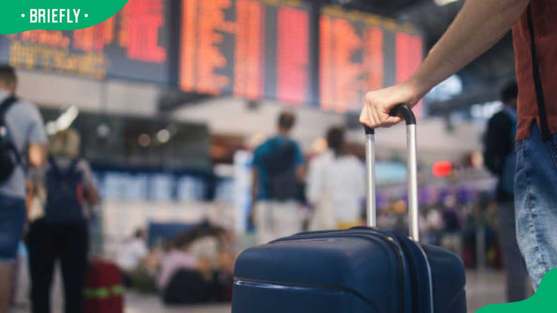 A passenger with a checked luggage at an airport