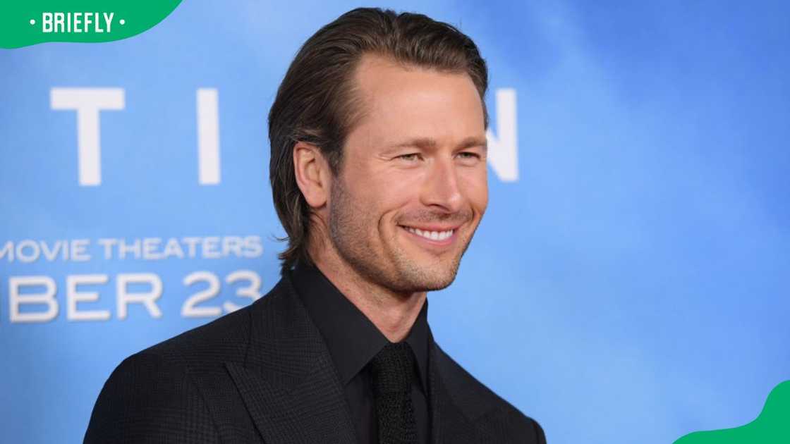 Glen Powell at the 2022 Los Angeles premiere of Devotion in Los Angeles, California