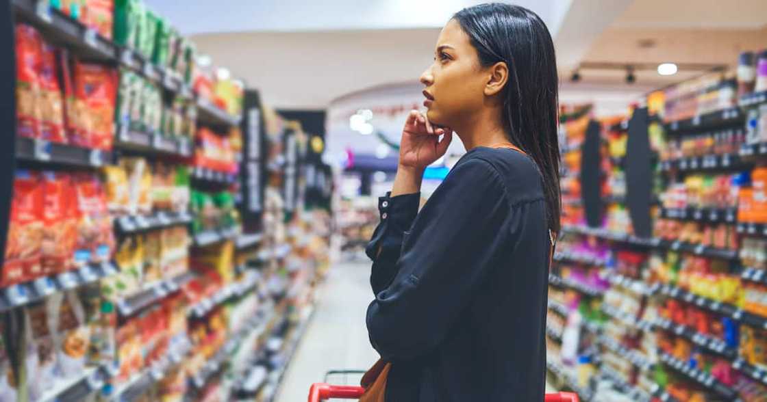 Shot of a young woman shopping in a grocery store Shot of a young woman shopping in a grocery store