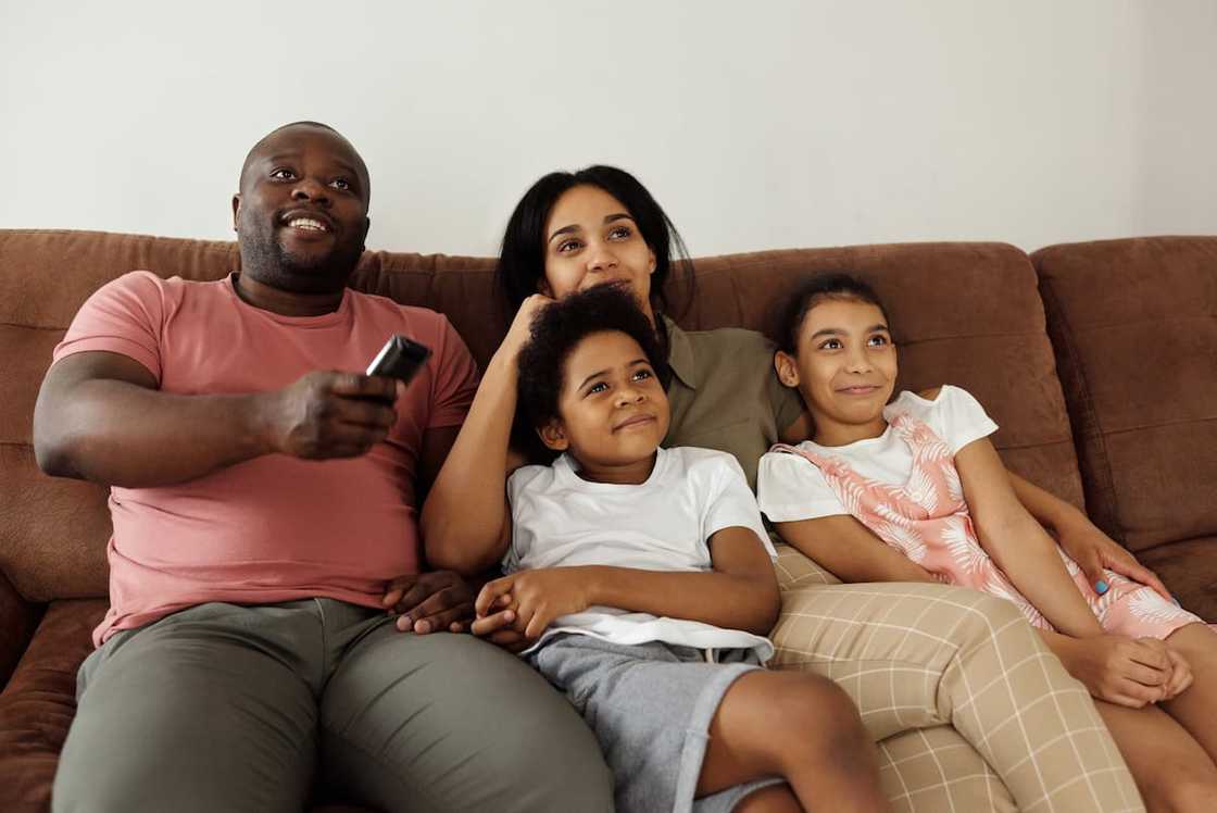 A family watching TV A family watching TV
