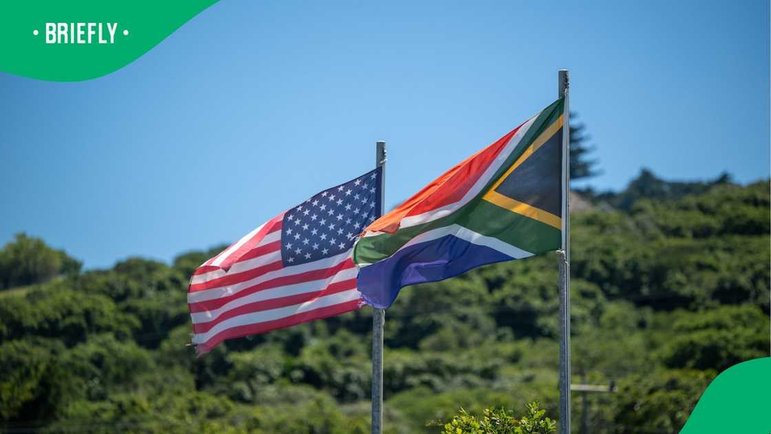 Photos of SA and US flags hoisted on a pole Photos of SA and US flags hoisted on a pole