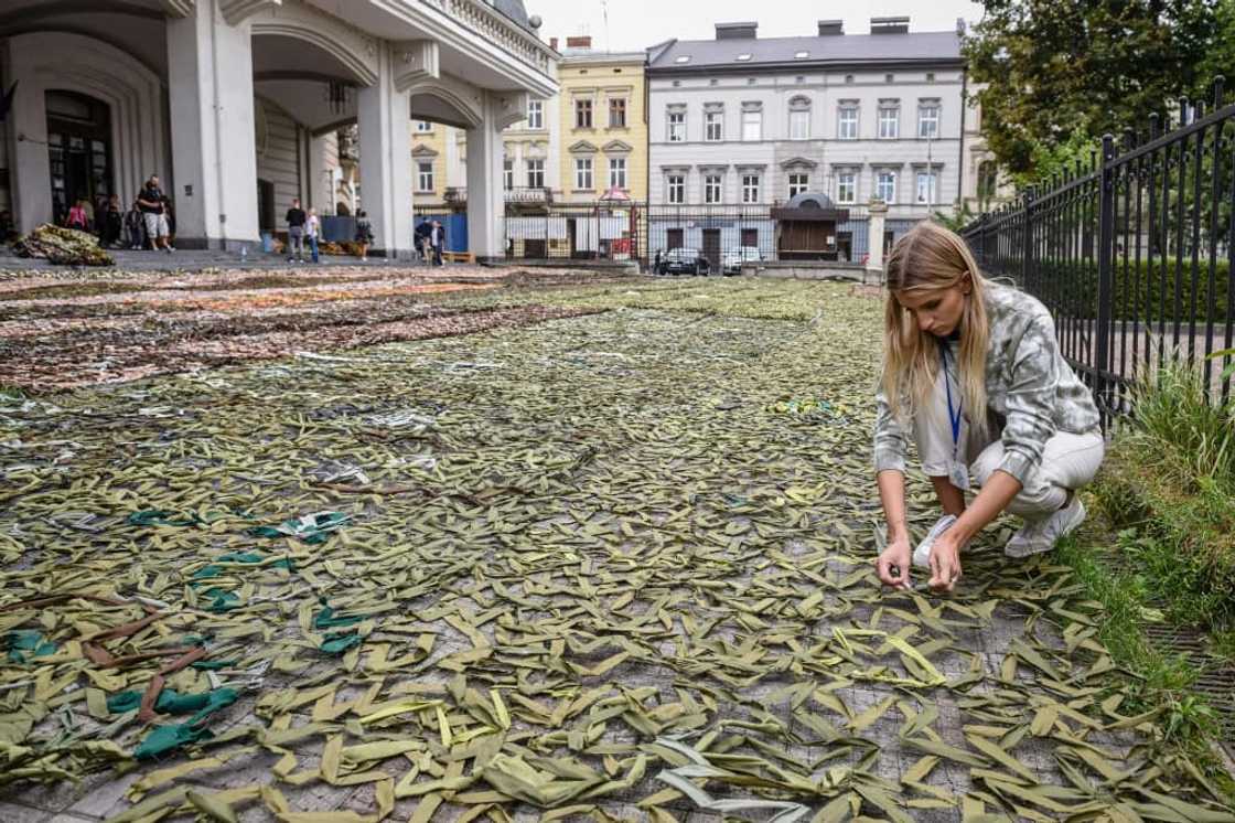 A woman makes camouflage nets for the Ukrainian military in Lviv