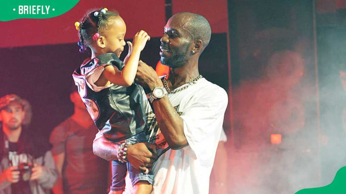 DMX on stage with daughter Aaliyah on stage DMX on stage with daughter Aaliyah on stage