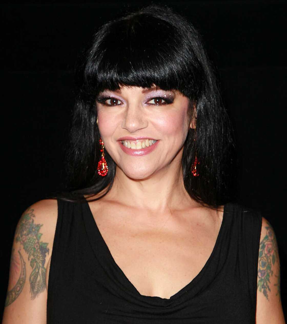 Pleasant Gehman wearing a black dress Pleasant Gehman wearing a black dress