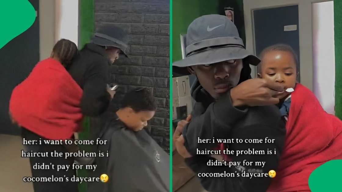 Barber holds child on his back while he cuts the mother's hair.