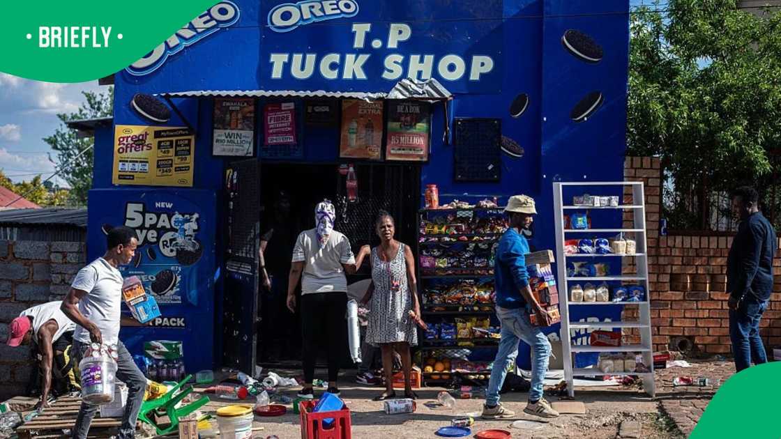 Foreign shop owners carry goods after local residents forced them to vacate their business in Orlando East on October 9, 2026 in Soweto, South Africa Foreign shop owners carry goods after local residents forced them to vacate their business in Orlando East on October 9, 2026 in Soweto, South Africa
