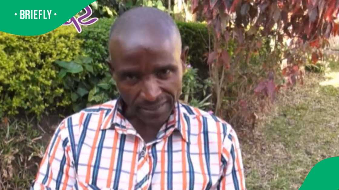 The visual showed a Ugandan man sitting outside