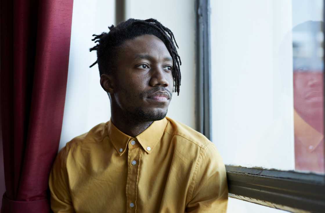 A thoughtful student looking out the window