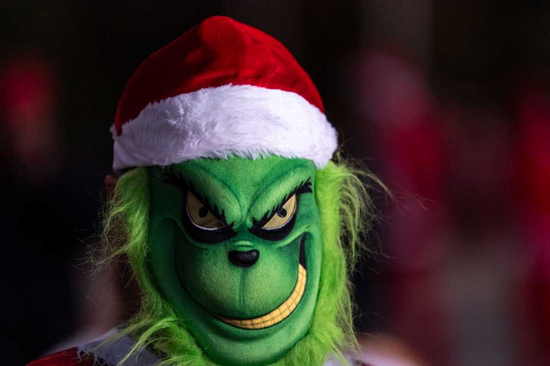 A runner dressed as the Grinch