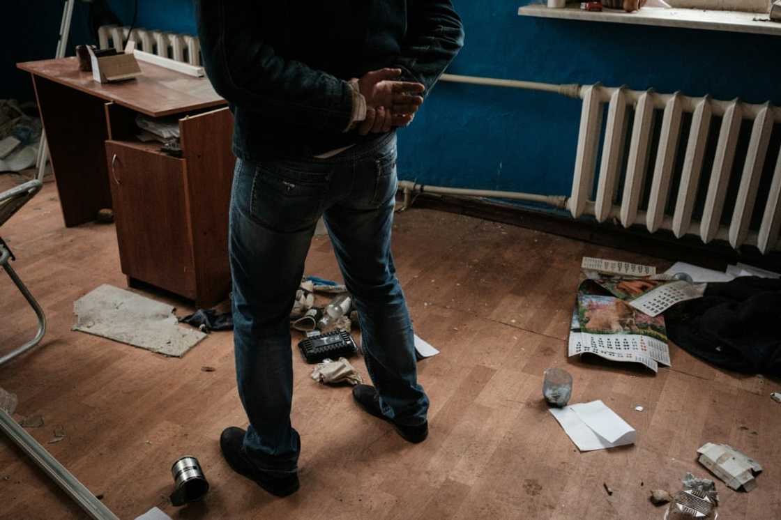 A man with relatives in Russian-annexed Crimea talks in a room where he says he was tortured by pro-Russian militia A man with relatives in Russian-annexed Crimea talks in a room where he says he was tortured by pro-Russian militia
