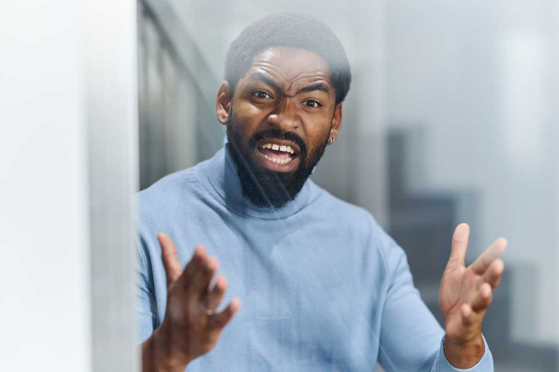 a displeased man talking a displeased man talking